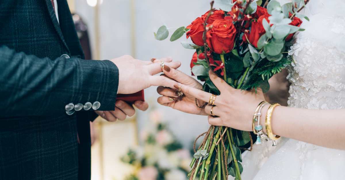 Photographer capturing the exchange of rings at a wedding for wedding photography Ireland.